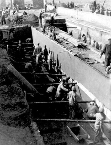 Auschwitz - Birkenau - KL Auschwitz II-Birkenau. Prisoners laboring. SS photograph, 1943..jpg